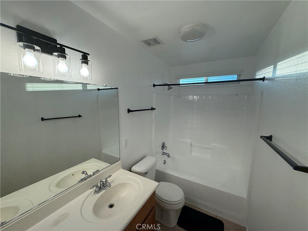 29162 Hydrangea Street Murrieta, CA 92563 - Photo 41 of 46 a bathroom with a sink toilet and shower