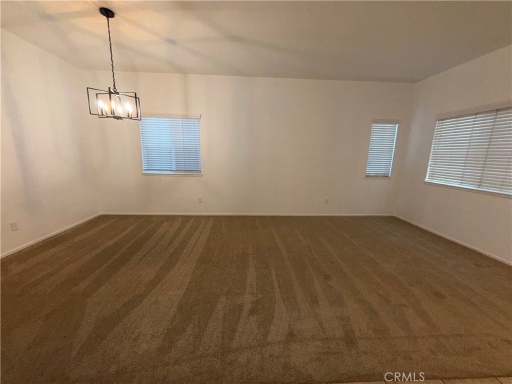 29162 Hydrangea Street Murrieta, CA 92563 - Photo 6 of 46 a view of a room with wooden floor and windows