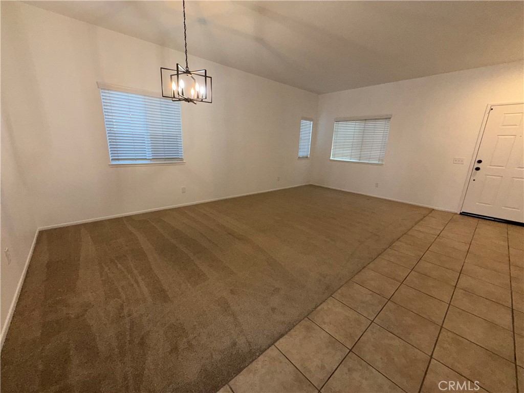 29162 Hydrangea Street Murrieta, CA 92563 - Photo 7 of 46 a view of an empty room with window
