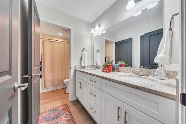 a spacious bathroom with a double vanity sink mirror and a