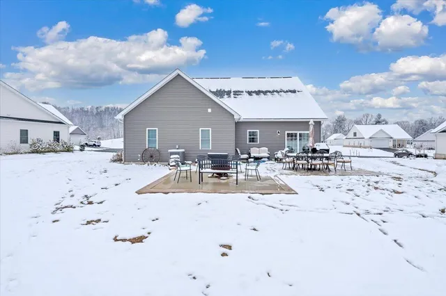 a view of kitchen with kitchen island microwave and stove