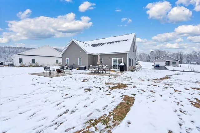 a view of a dry chairs in front of house
