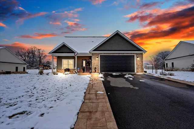 a front view of a house with yard