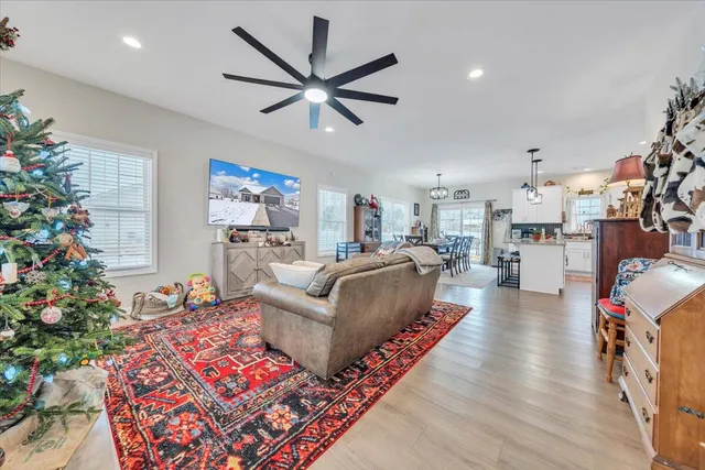 a living room with furniture and a large window