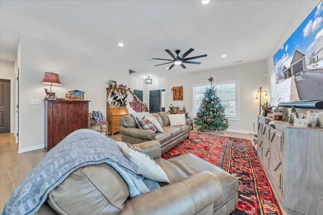 a living room with furniture fireplace and a flat screen tv