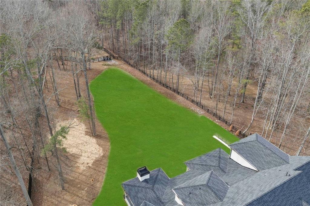 2309 Dinsmore Road Milton, GA 30004 - Photo 69 of 87 a green field with some trees in the background