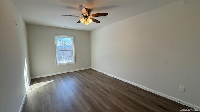 135 Cooper Road, Unit 1 Fishkill, NY 12524 - Photo 10 of 12 Empty room with ceiling fan and dark hardwood / wood-style floors