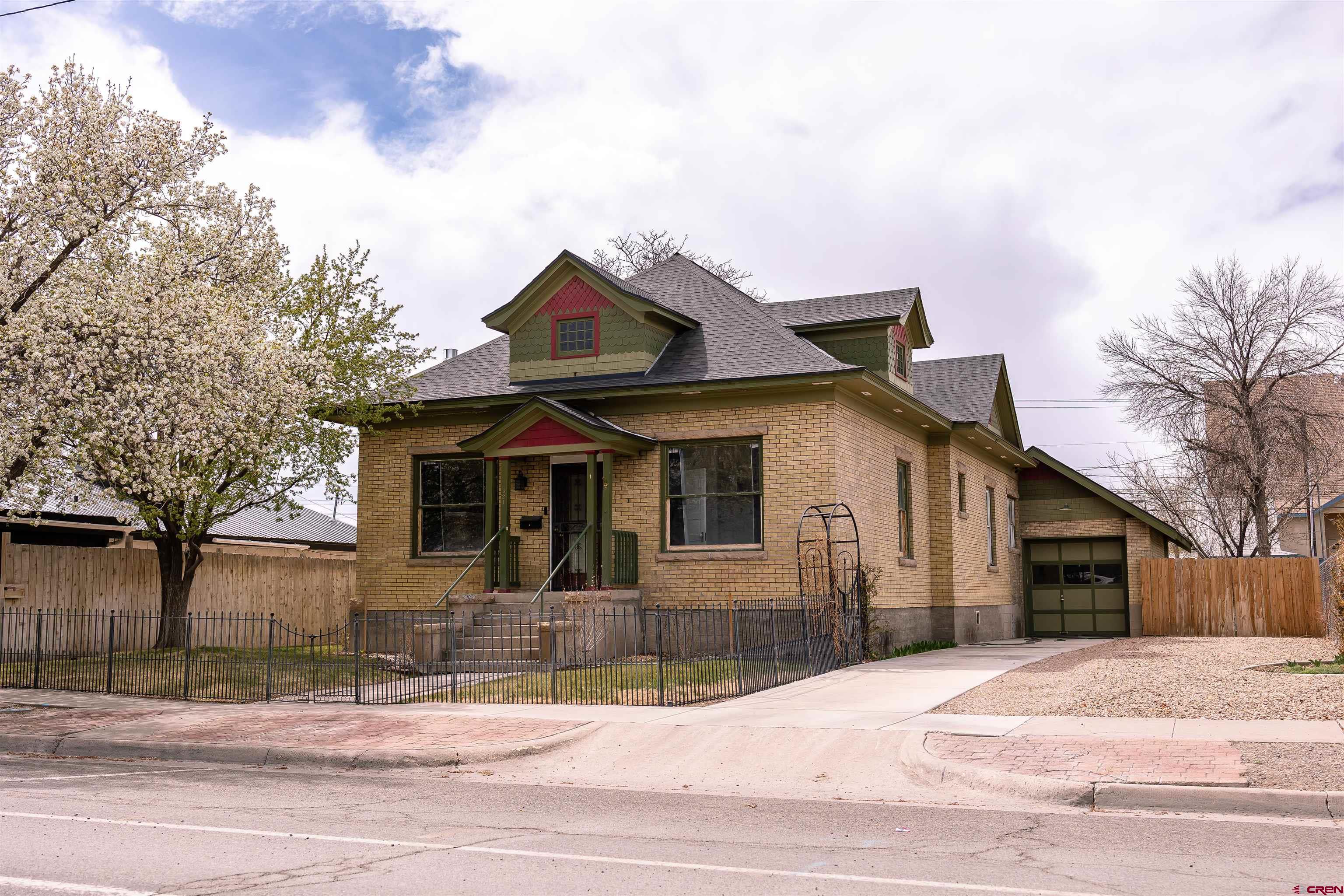 a front view of a house with a garage