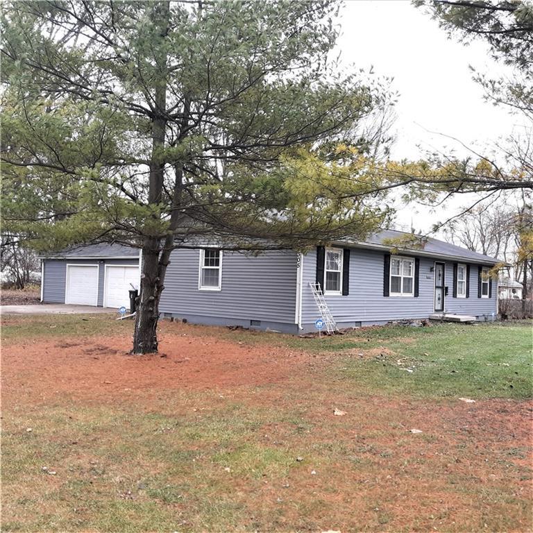 2305 East Hickory Street Decatur, IL 62521 - Photo 1 of 1 a house that has a tree in front of it