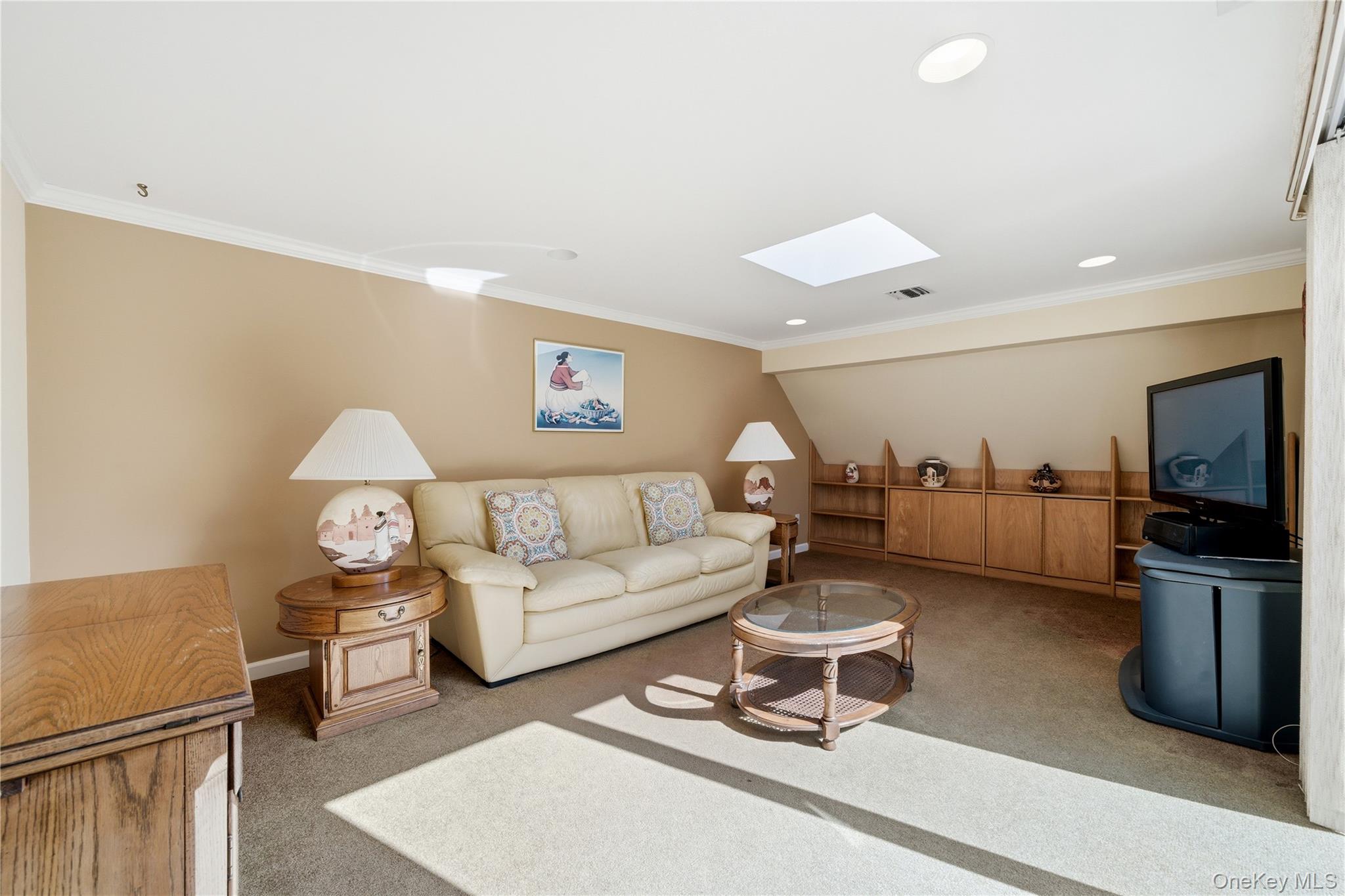 282 Helm Lane Bay Shore, NY 11706 - Photo 18 of 48 a living room with furniture and a flat screen tv