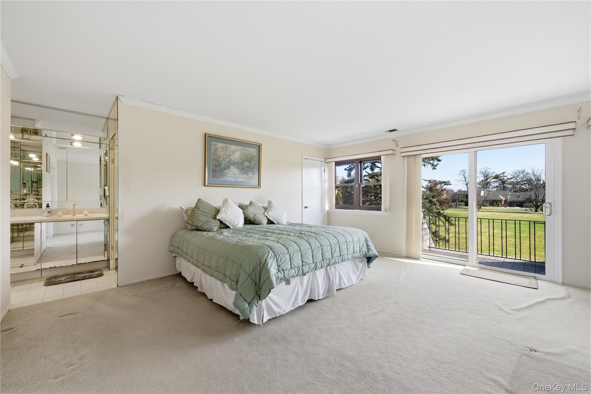 282 Helm Lane Bay Shore, NY 11706 - Photo 22 of 48 a spacious bedroom with a large bed and a large window