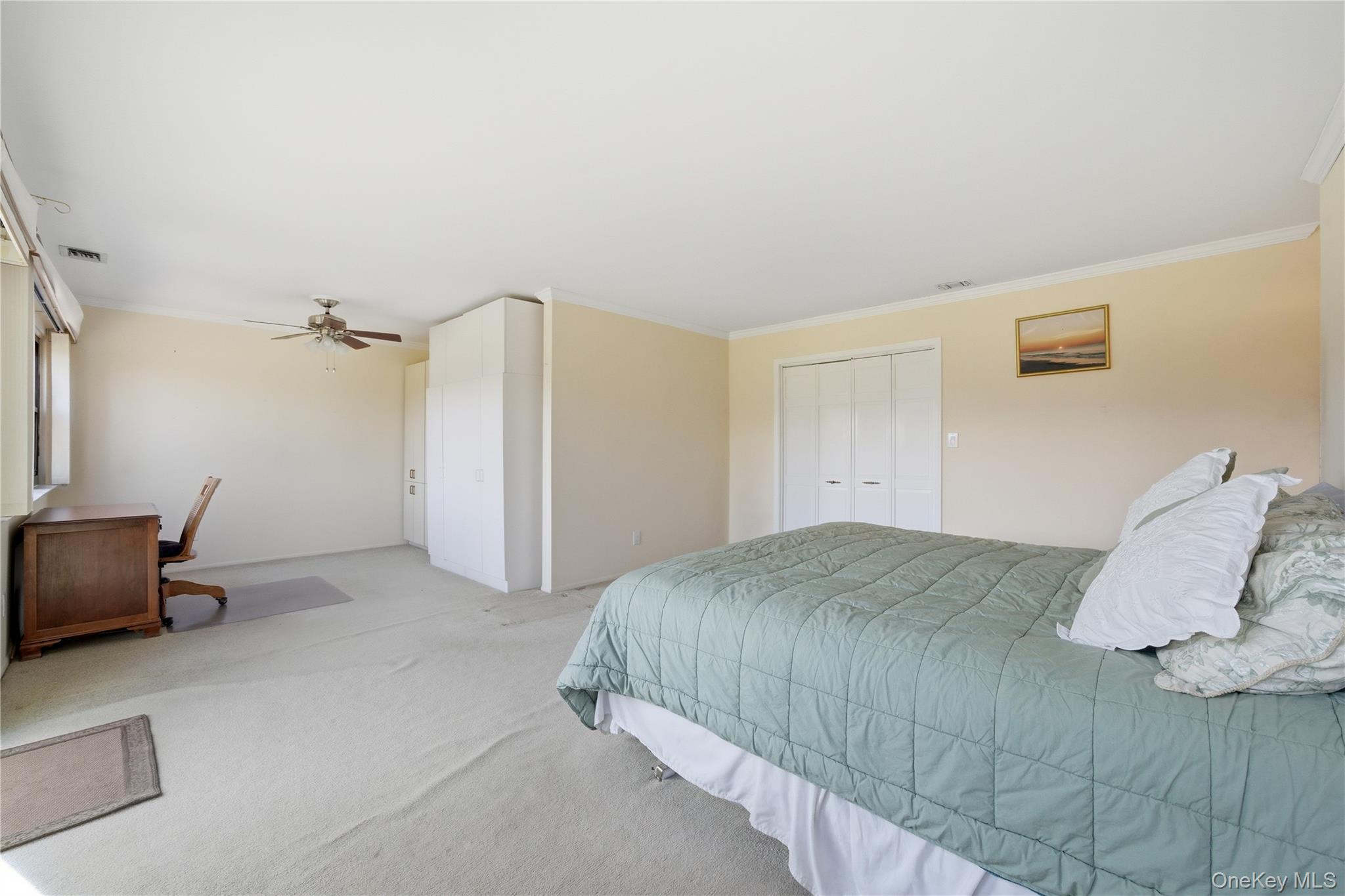 282 Helm Lane Bay Shore, NY 11706 - Photo 23 of 48 a bedroom with a bed and a chair