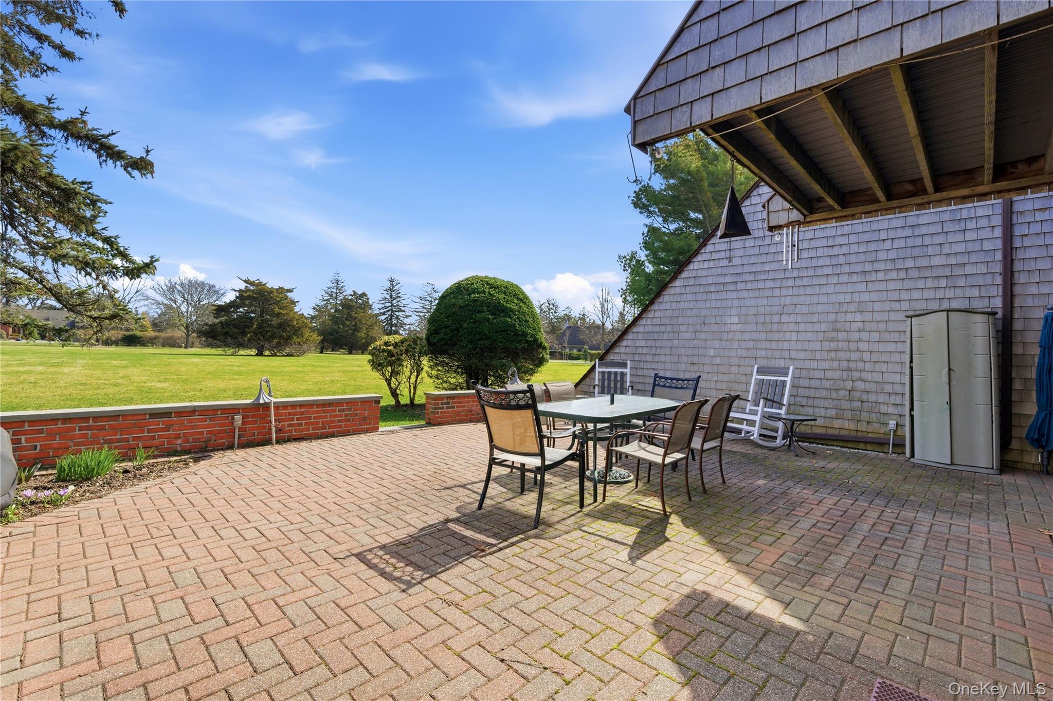 282 Helm Lane Bay Shore, NY 11706 - Photo 29 of 48 a backyard of a house with table and chairs