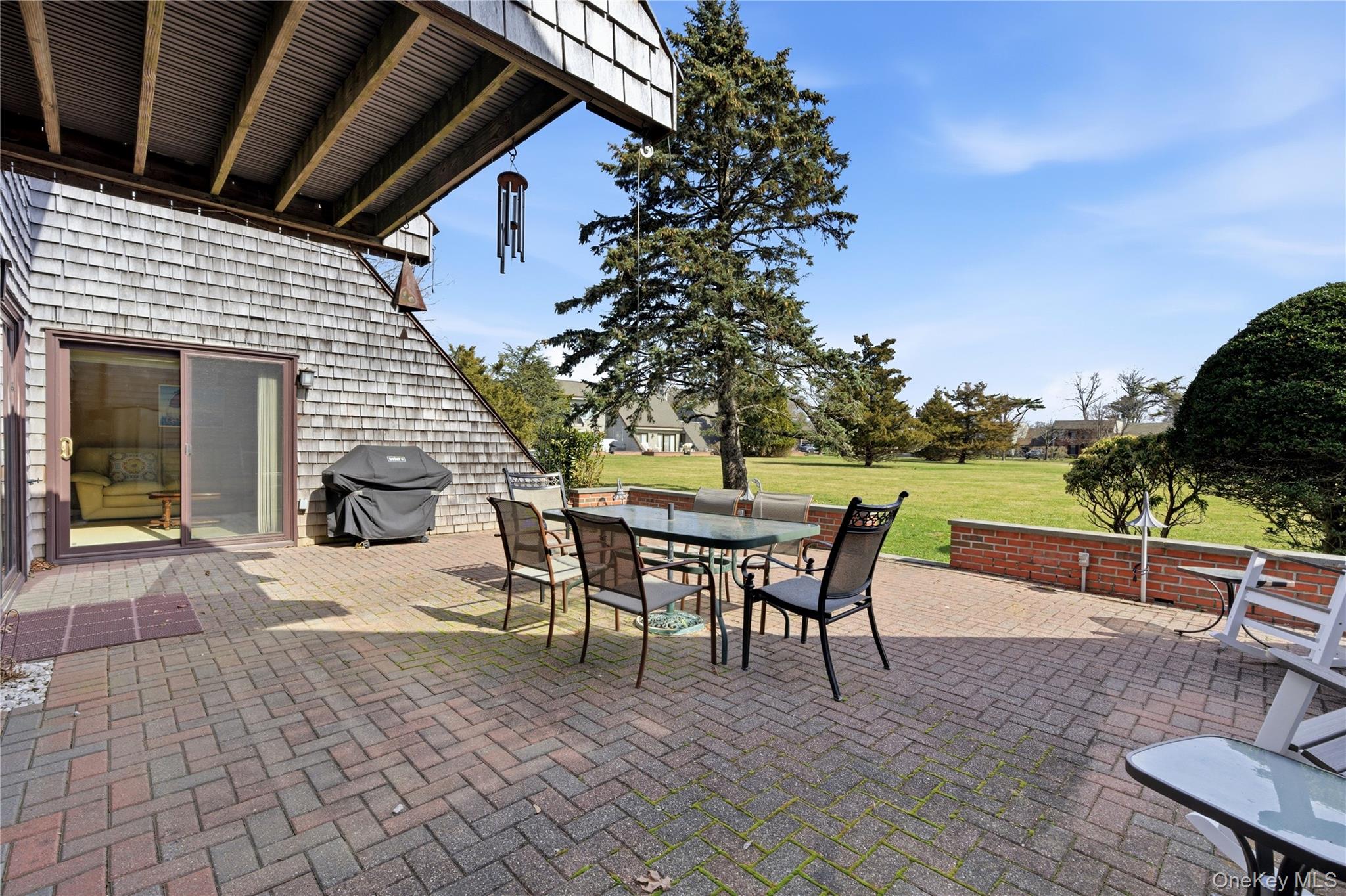 282 Helm Lane Bay Shore, NY 11706 - Photo 30 of 48 a view of a patio with a table and chairs