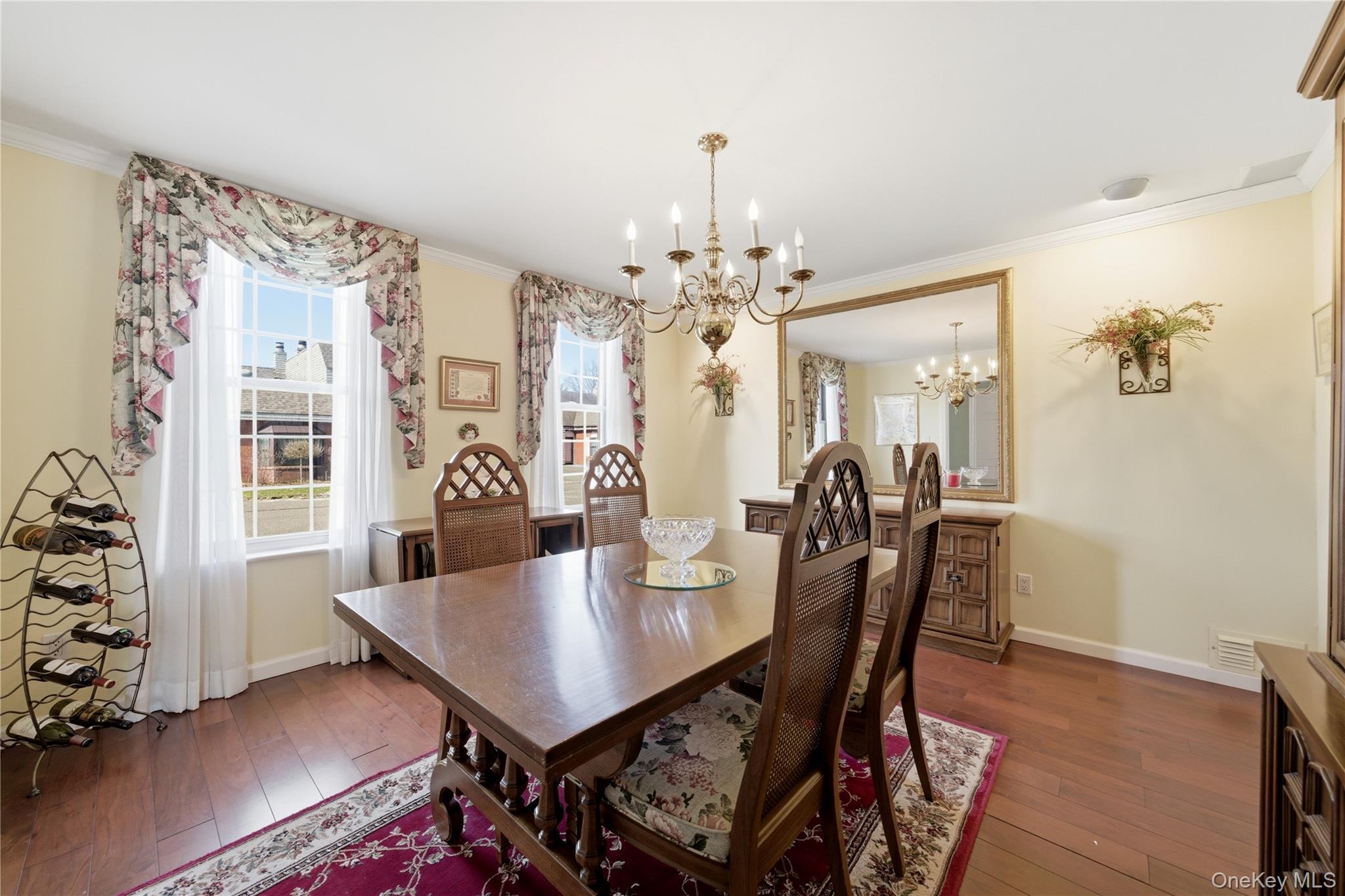 282 Helm Lane Bay Shore, NY 11706 - Photo 4 of 48 a view of a dining room with furniture and chandelier