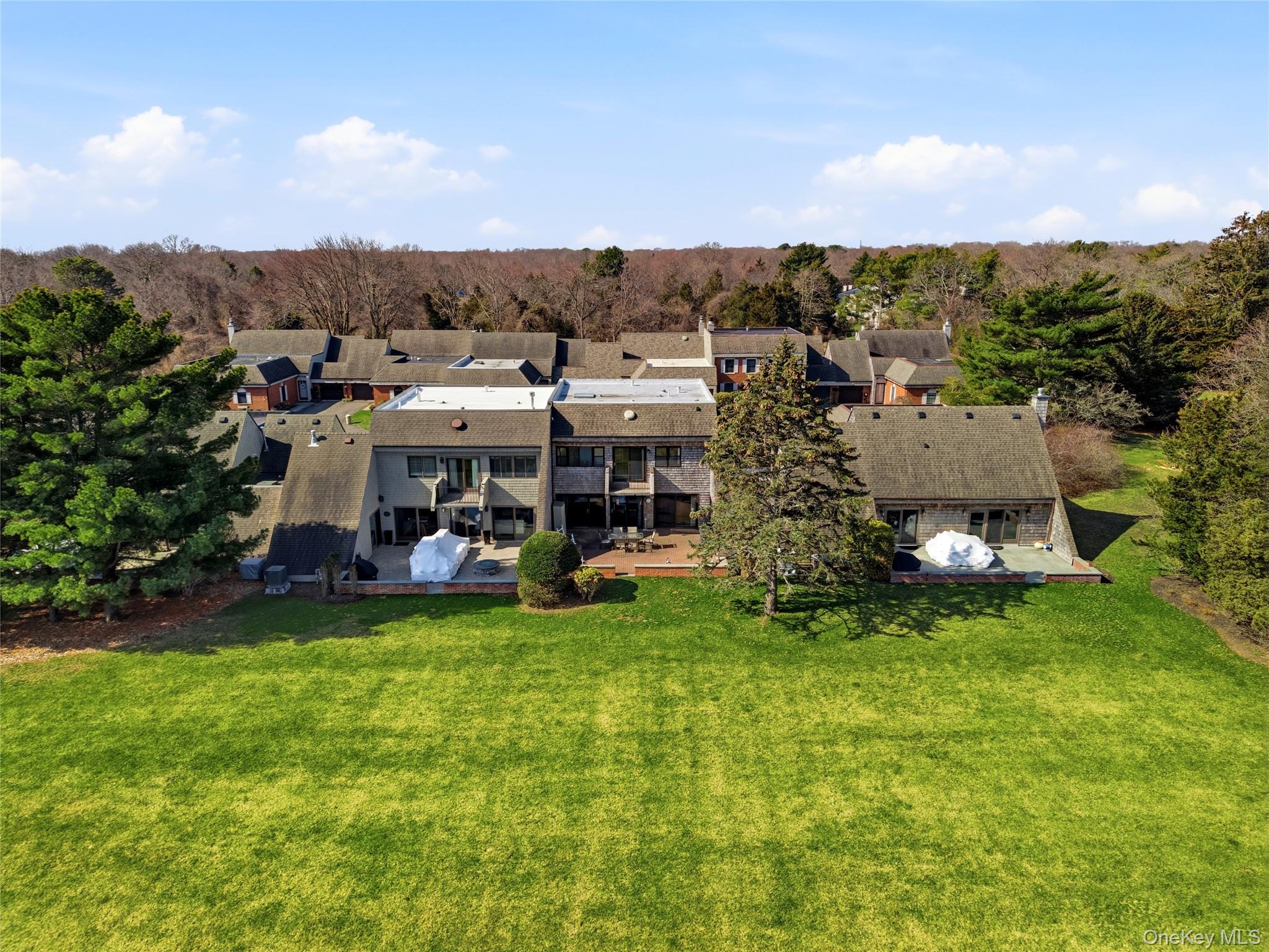 282 Helm Lane Bay Shore, NY 11706 - Photo 41 of 48 a view of a house with a garden and trees