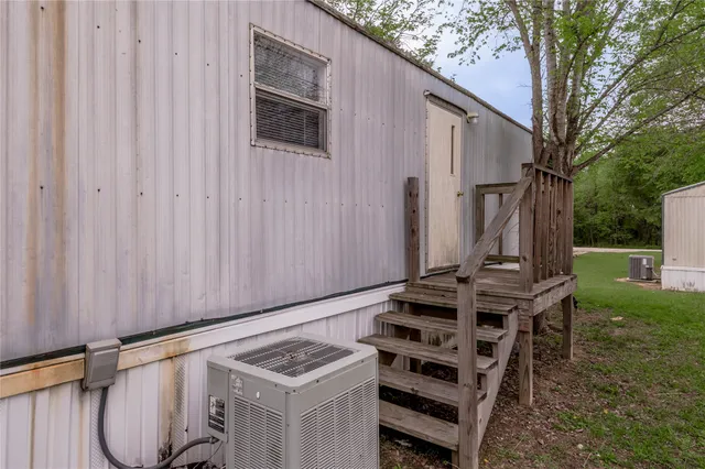 a view of outdoor space with wooden deck and furniture