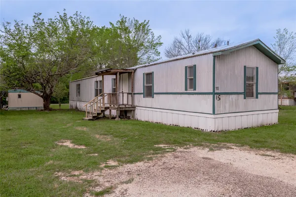 a view of a back yard of the house