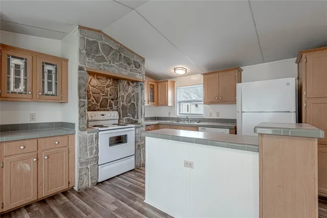 a kitchen with a white cabinets and white appliances
