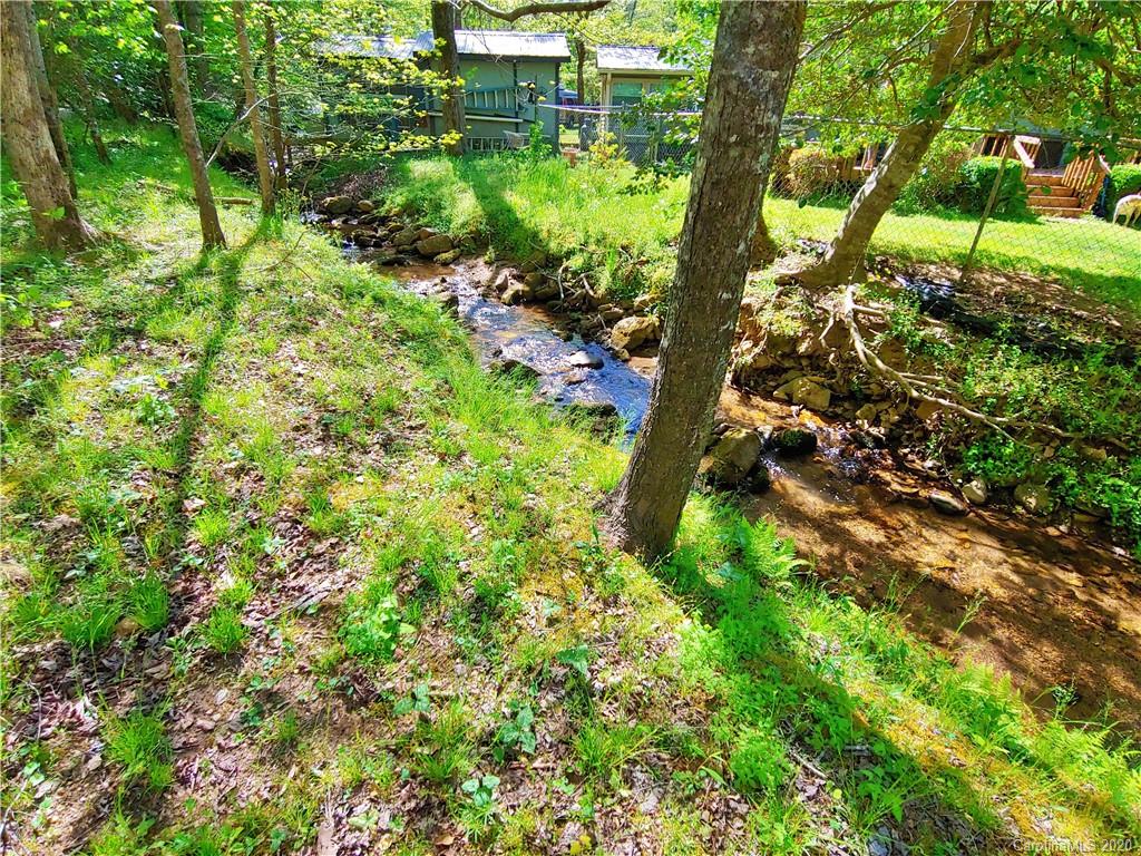128 Home Road Mill Spring, NC 28756 - Photo 5 of 36 a view of a garden