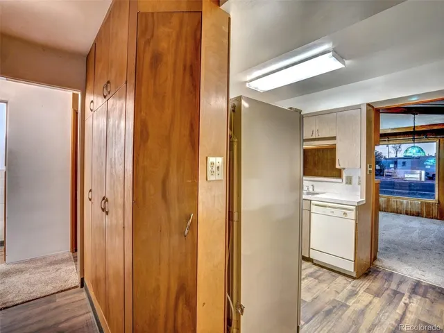 a view of a refrigerator in kitchen and wooden floor