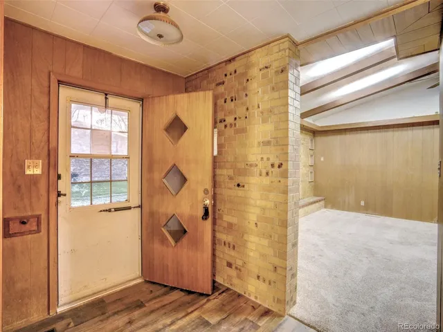 a view of a bathroom with a shower and a window