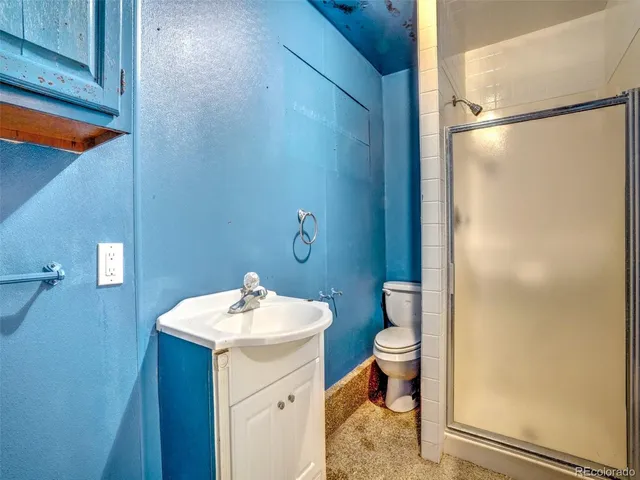 a view of an empty room and a window