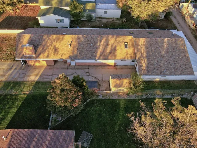 a view of a swimming pool with a yard
