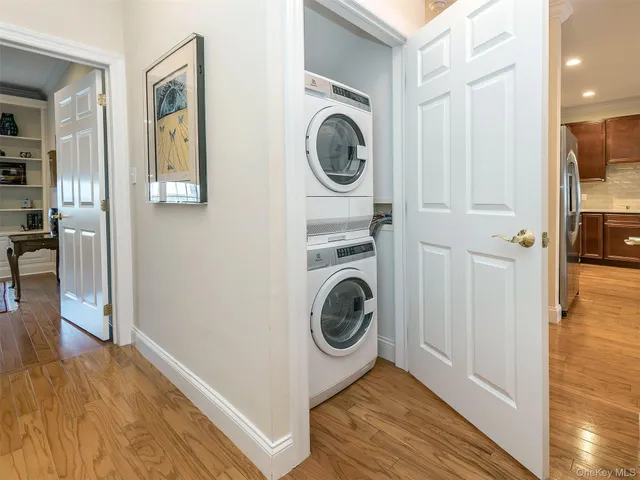 a view of a hallway with washer and dryer