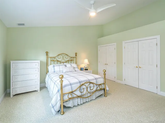 a bedroom with a bed and dresser
