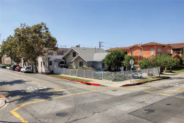a view of a house with a yard and roof deck