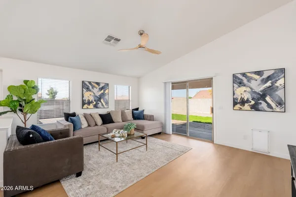 a living room with furniture and a large window