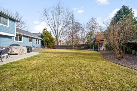 a view of swimming pool with outdoor seating and yard in the back