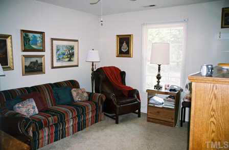 4504 Lafferty Court Raleigh, NC 27616 - Photo 3 of 6 a living room with furniture and a window