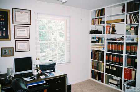 4504 Lafferty Court Raleigh, NC 27616 - Photo 5 of 6 a view of a workspace with bookshelf and a window