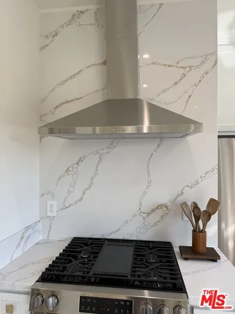 a close view of a stove top oven a counter space and cabinets