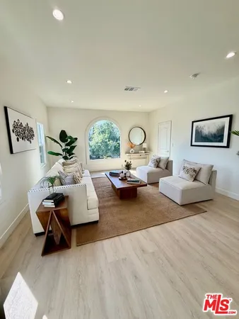 a living room with furniture and window