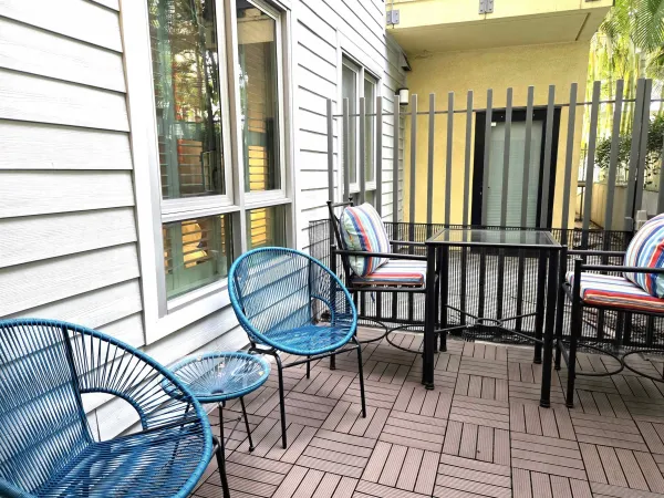a view of a chairs and table in the patio