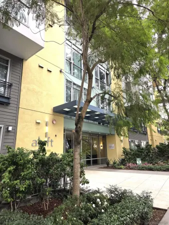 a front view of a building with a garden