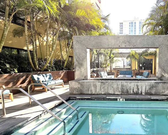 a view of a backyard with couches chair and wooden floor