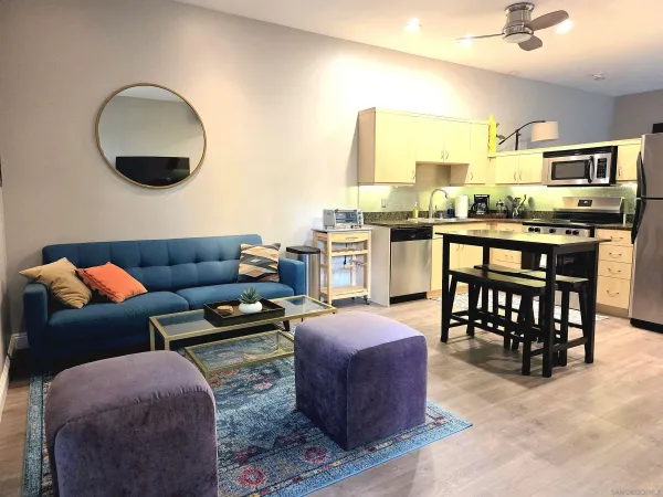 a living room with fireplace furniture and a flat screen tv