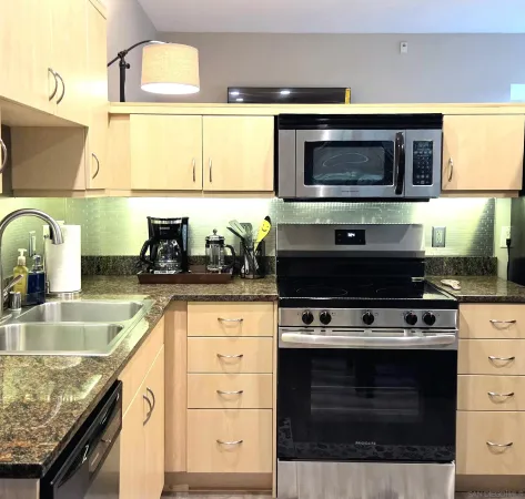 a kitchen with a stove and a microwave