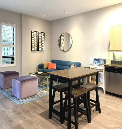 a view of a dining room with furniture and a table