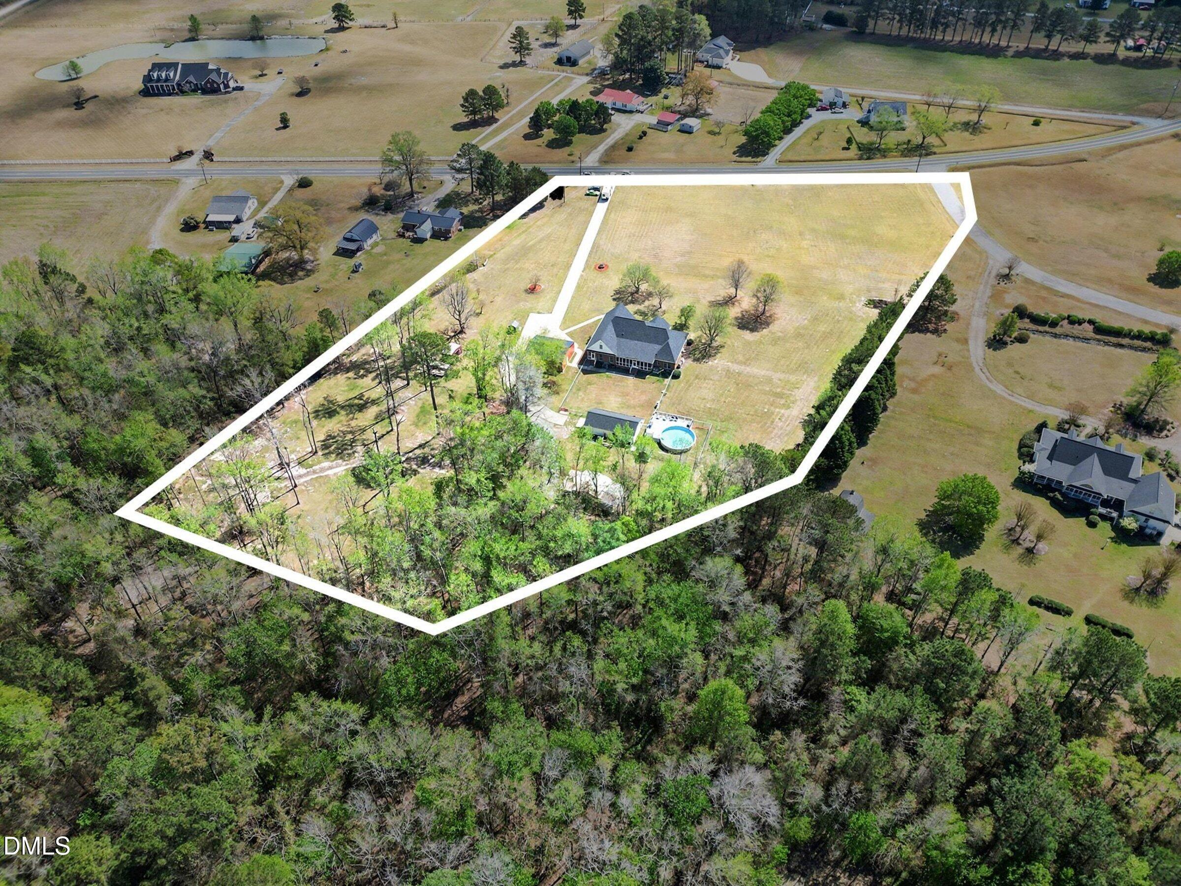 430 Fred Hall Road Stedman, NC 28391 - Photo 38 of 63 an aerial view of a house with a yard and lake view