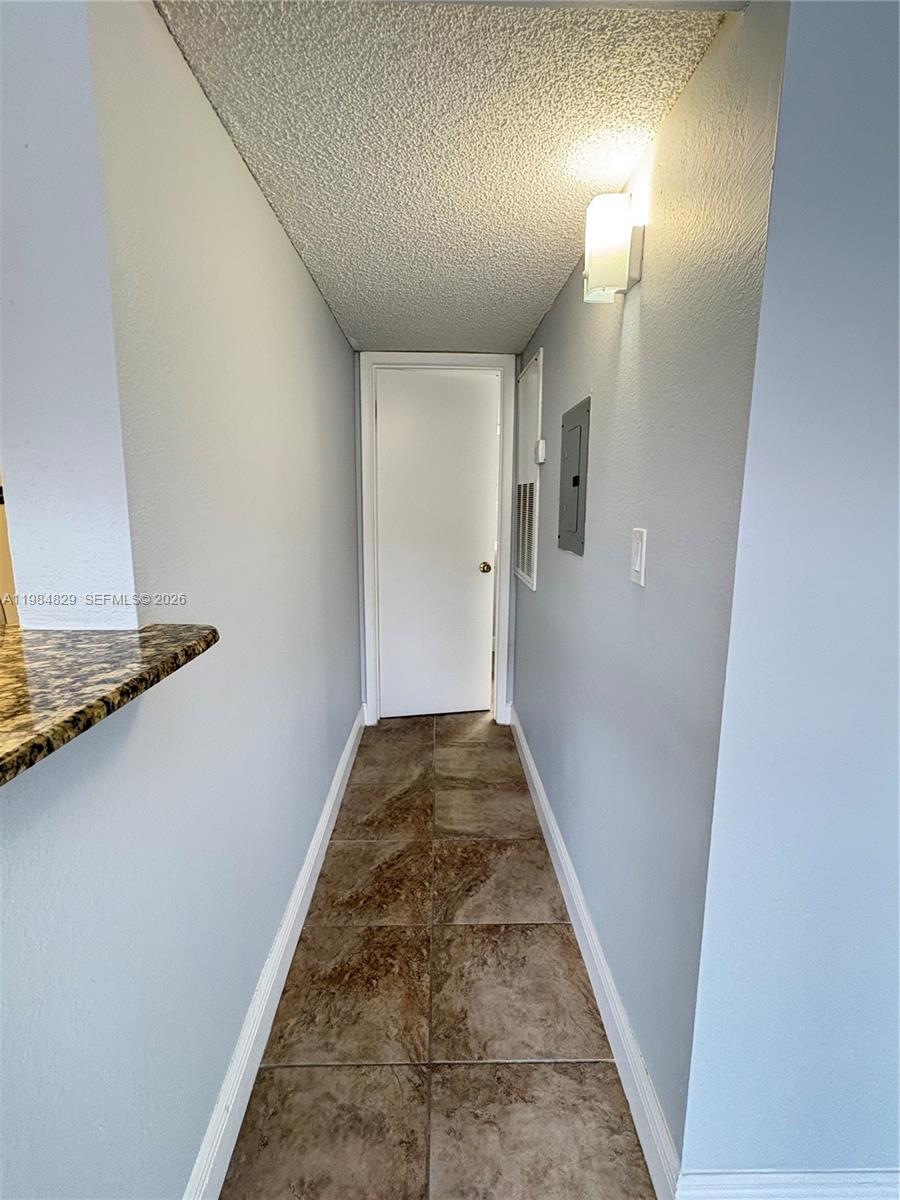 10501 Southwest 155th Court, Unit 1124 Miami, FL 33196 - Photo 11 of 15 a view of a hallway