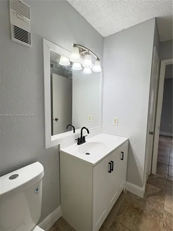 a utility room with sink dryer and washer