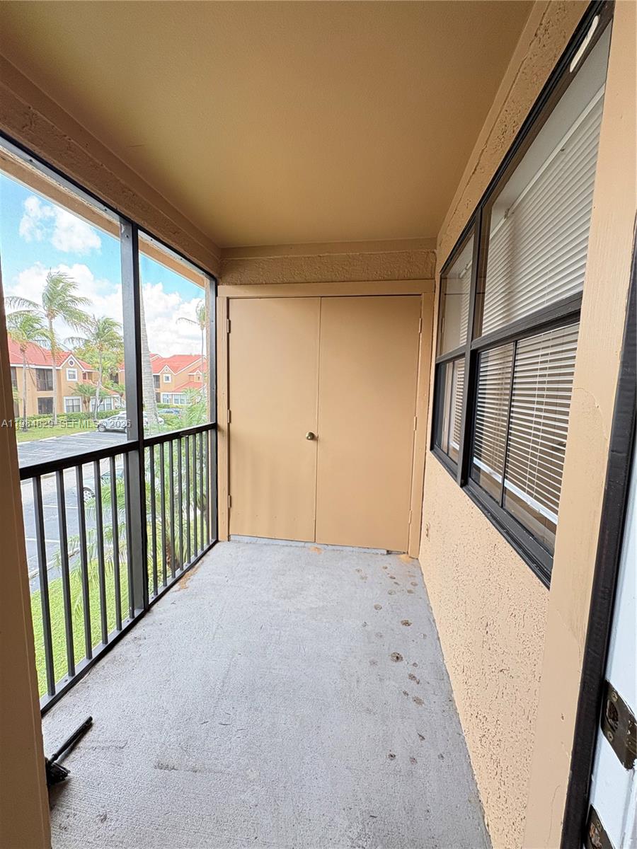 10501 Southwest 155th Court, Unit 1124 Miami, FL 33196 - Photo 14 of 15 a view of a big room with wooden floor and windows