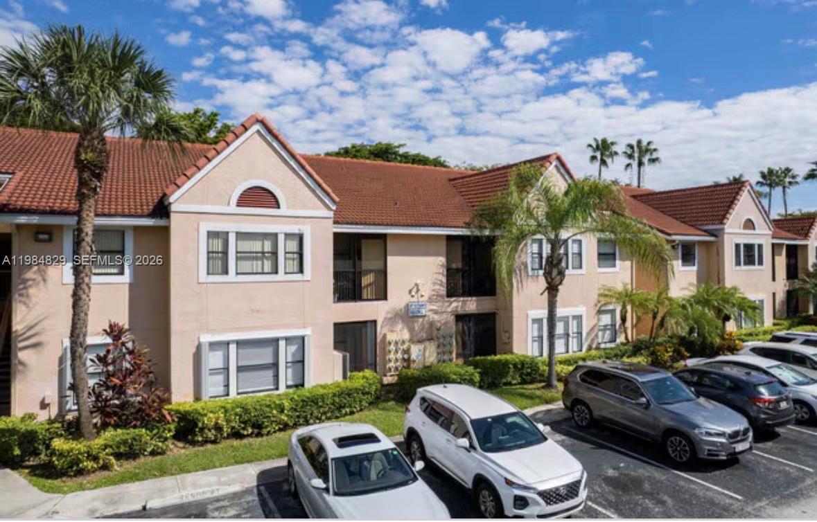 10501 Southwest 155th Court, Unit 1124 Miami, FL 33196 - Photo 15 of 15 a front view of a house with garden