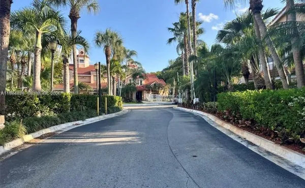 a view of a street with a building in the background