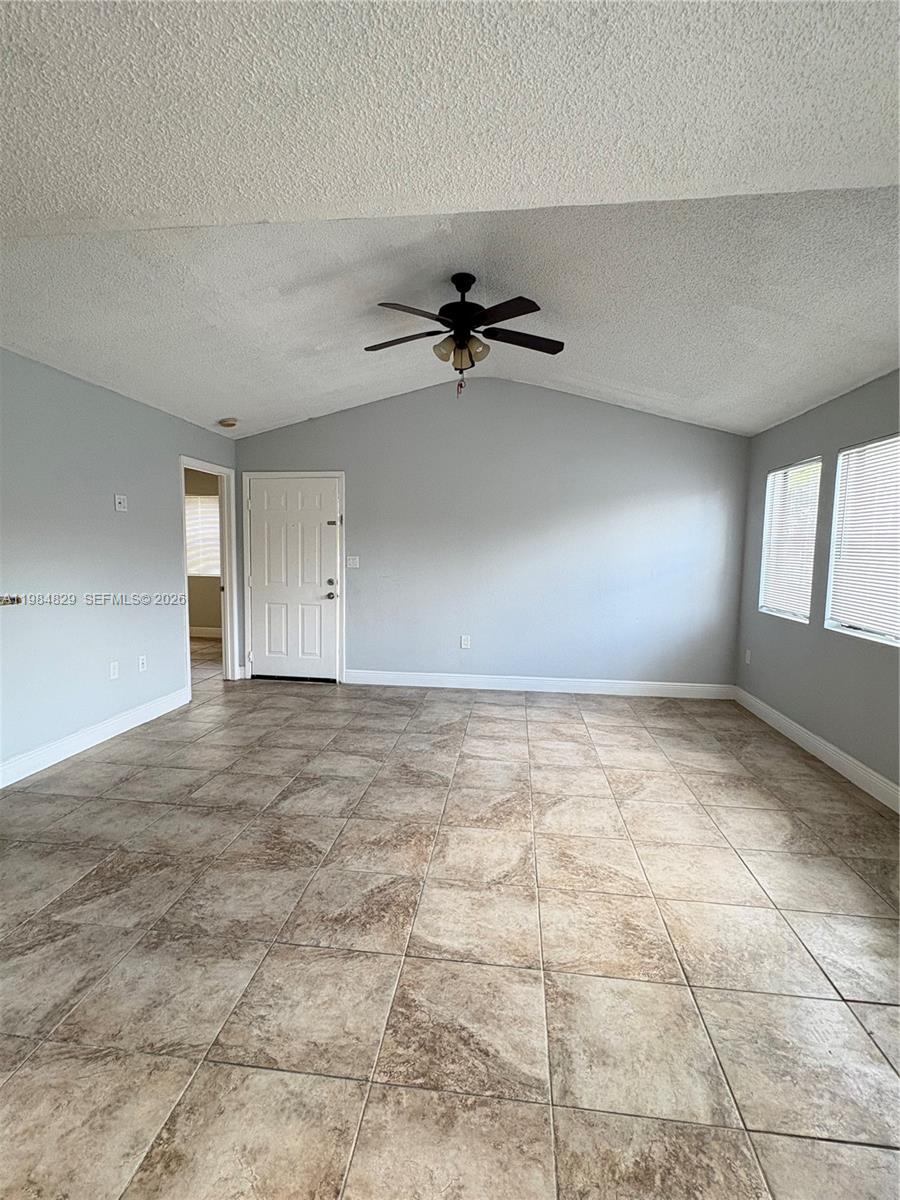 10501 Southwest 155th Court, Unit 1124 Miami, FL 33196 - Photo 8 of 15 a view of an empty room and window fan